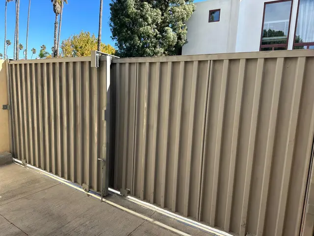 Gate with metal panels