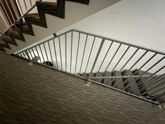 White railing detail beside stairs