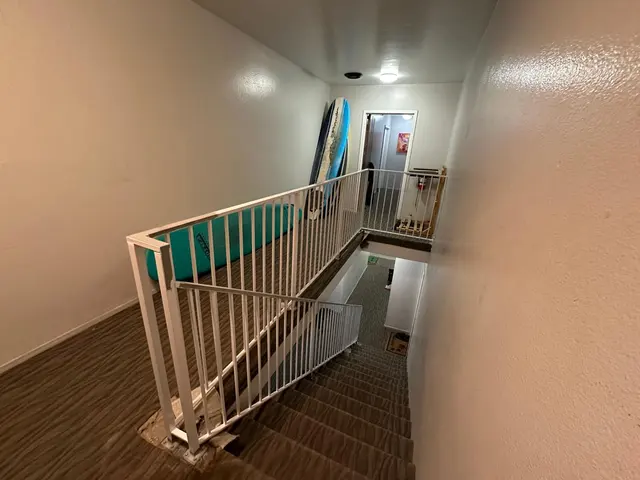 White railings on indoor stairs